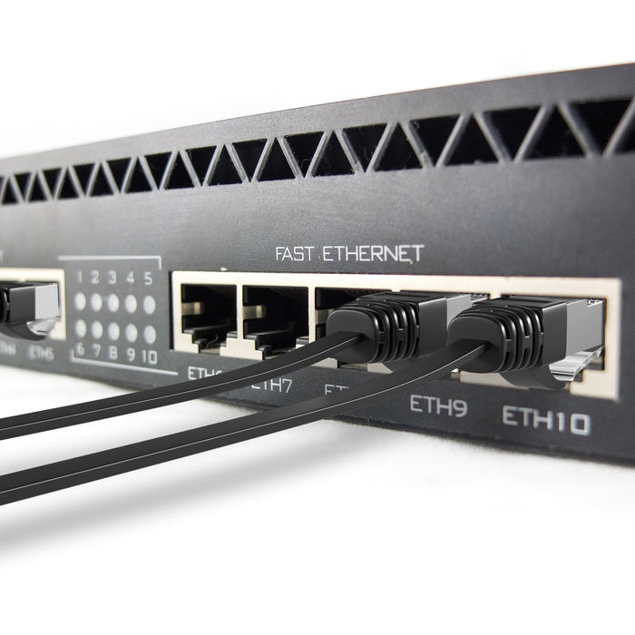 Mr. Tronic Cat 6 cable, black, installed along a wall in a home network